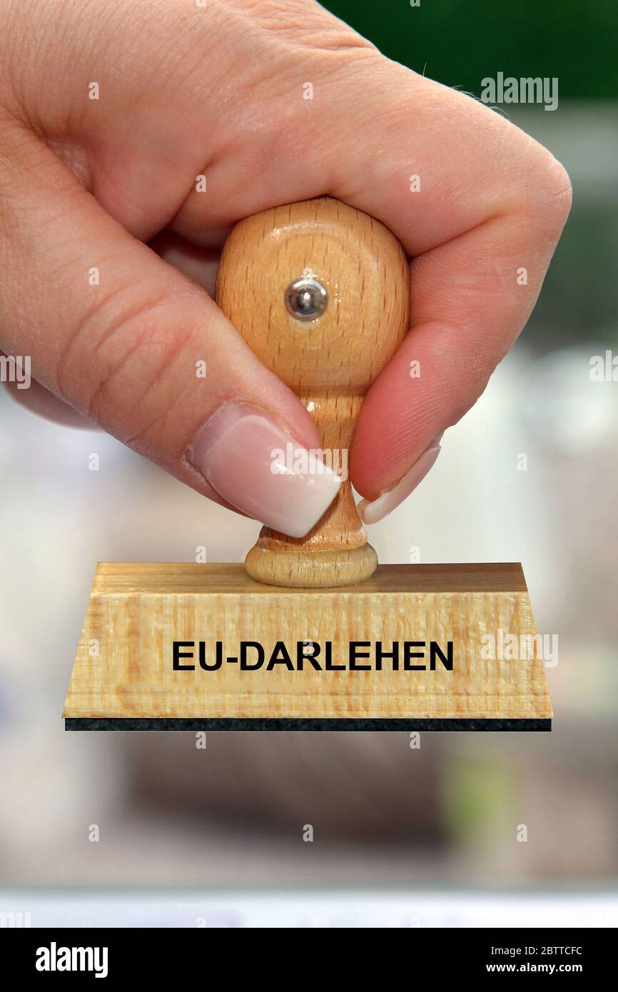 Hand mit Stempel, Frauenhand, Aufschrift: EU Darlehen Stock Photo