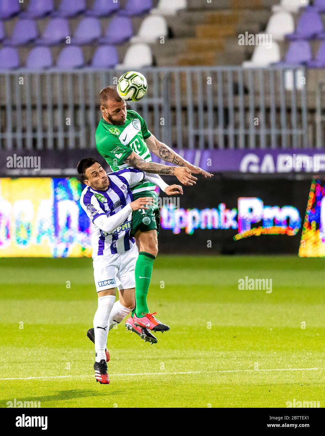 BUDAPEST, HUNGARY - MAY 27: (r-l) Endre Botka of Ferencvarosi TC challenges  Krisztian Simon of Ujpest FC during the Hungarian OTP Bank Liga match  between Ujpest FC and Ferencvarosi TC at Ferenc