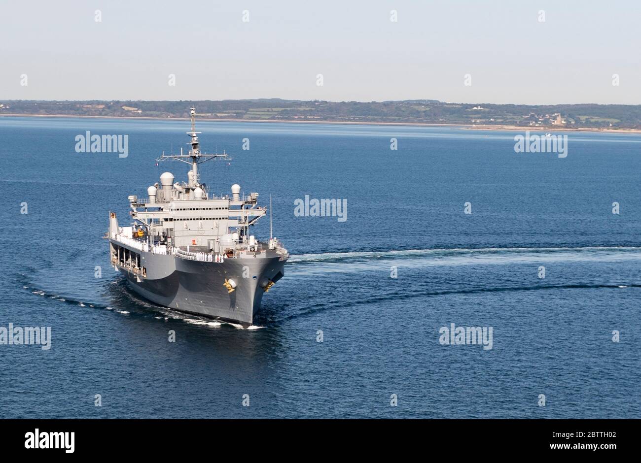 U.S. Navy sailors assigned to the Blue Ridge-class command and control ship USS Mount Whitney participate in a memorial ceremony in honor of Memorial Day May 26, 2020 off the coast of Normandy, France. Stock Photo