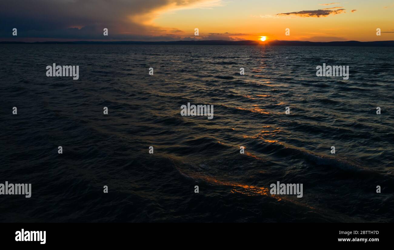 Lake Balaton in sunset. The waves rippling in the wind. Stock Photo