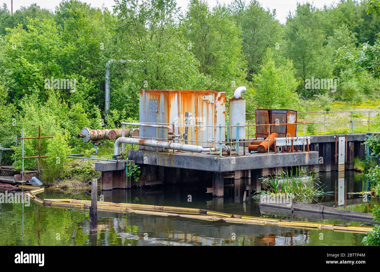 Disused pump machinery at the site of the former BP Llandarcy Oil Refinery, the first UK oil refinery, Neath Port Talbot, south Wales, now remediated Stock Photo