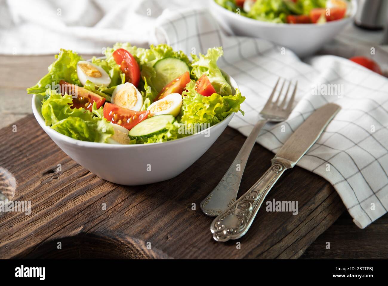 Tasty salad of fresh vegetables with quail eggs. Diet concept Stock Photo