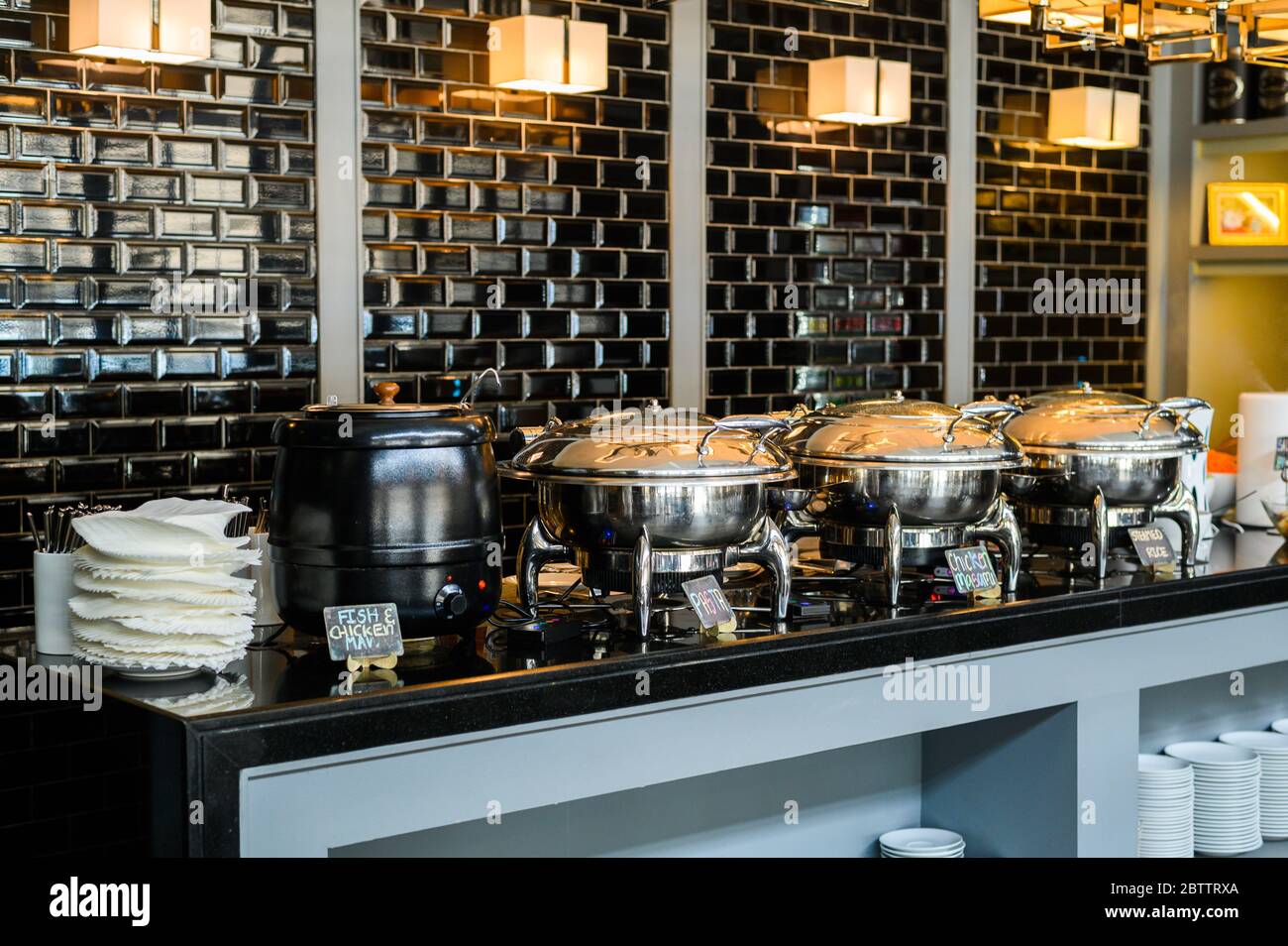 Buffet Table with Row of Food Service Steam Pans Stock Photo