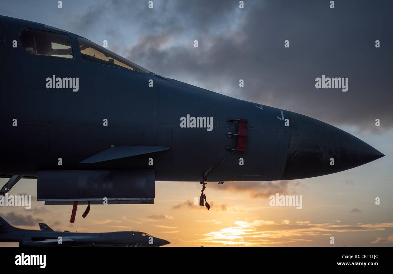 A U.S. Air Force jB-1B Lancer stealth bomber aircraft from the 9th Expeditionary Bomb Squadron, on the flight line at sunset on Andersen Air Force Base May 8, 2020 in Yigo, Guam. Stock Photo