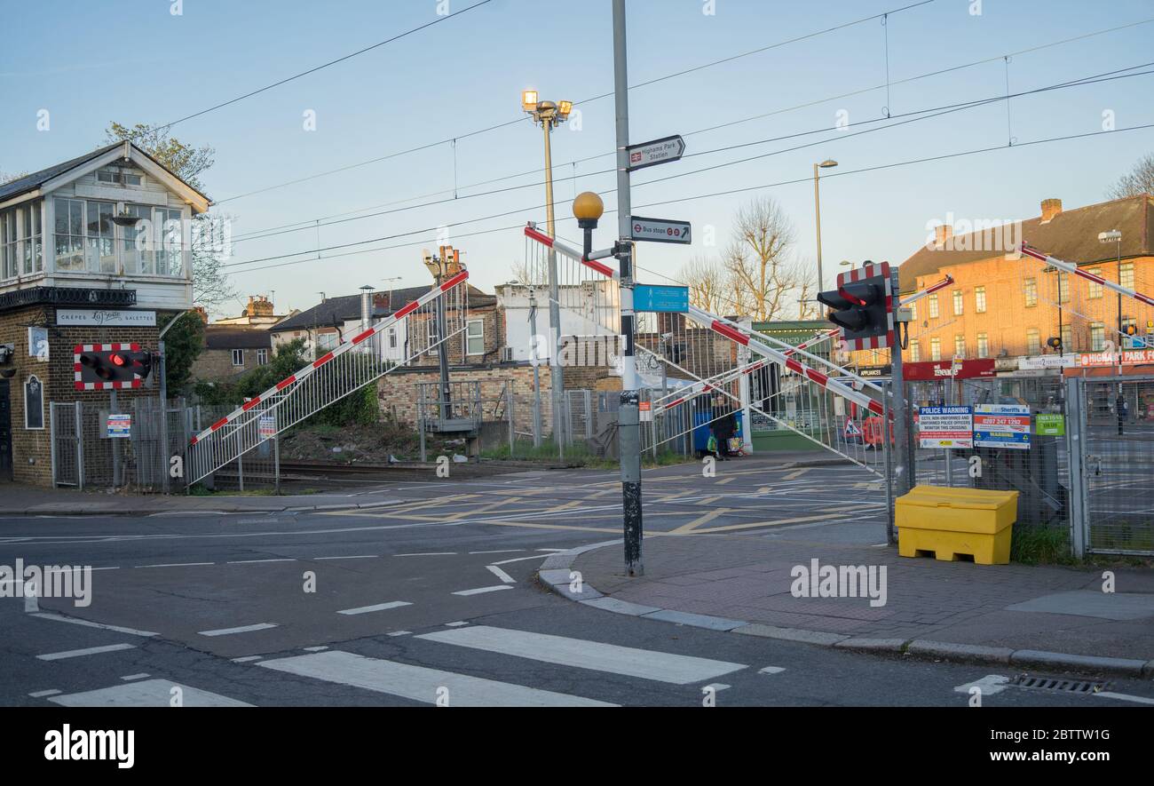 Highams Park railway level crossing opening in the morning. London, England. Stock Photo