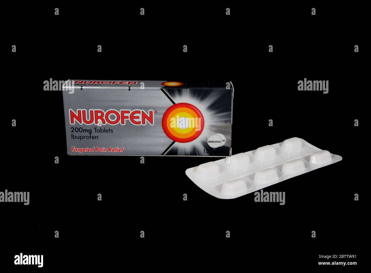 Packet of Nurofen 200mg Ibuprofen Caplets against a black background. Stock Photo