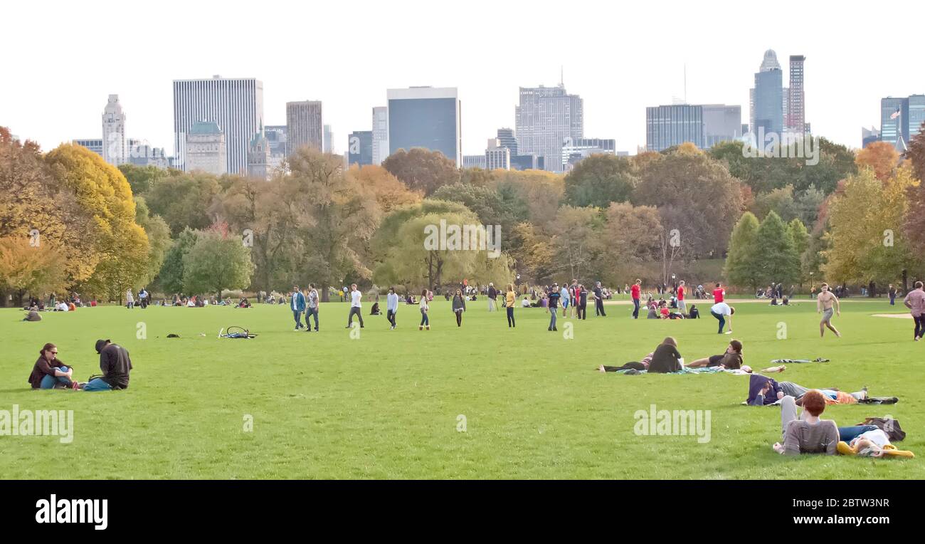 People relaxing in Central Park, Manhattan, New York, USA Stock Photo