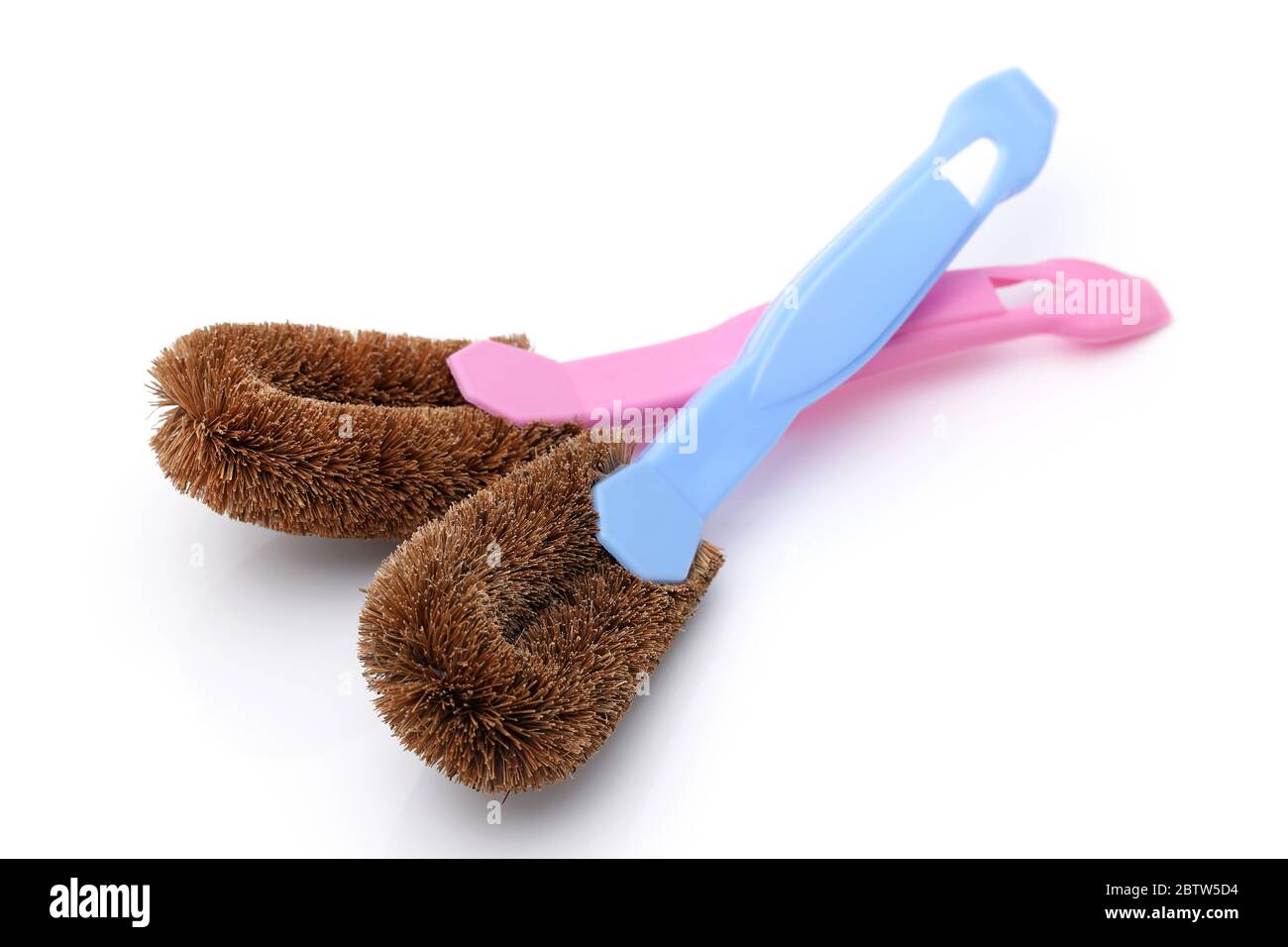 Coconut coir fiber scrubbing brush with handle on white background Stock Photo