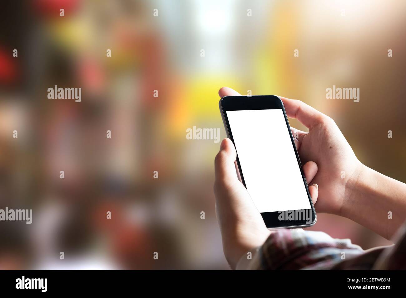 Close up Woman hand Using a Smart Phone with blur background Stock Photo