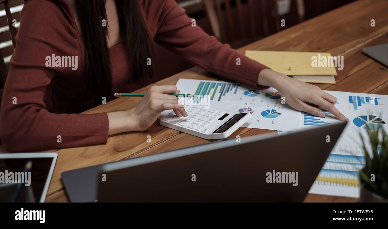 bookkeeper or financial inspector hands making report, calculating or checking balance. Stock Photo