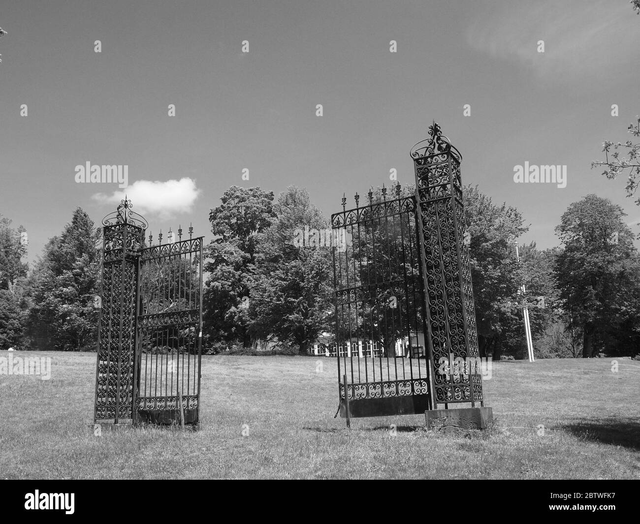 Wrought iron gates on the grounds of the Ringwood Manor in Ringwood State Park in New Jersey. A black and white image of early ironworks. Stock Photo