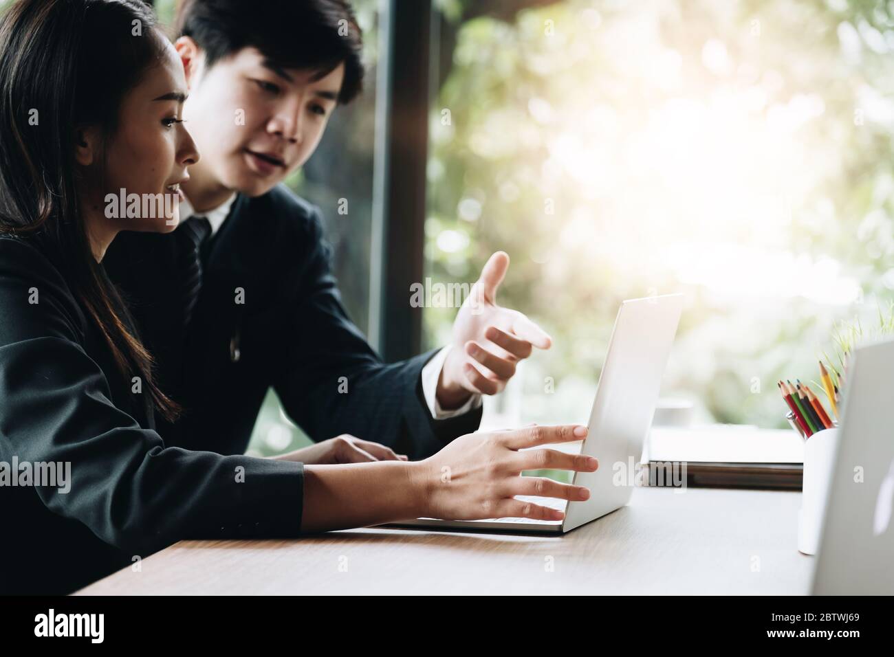 Young Business People Executive Analyzing Statistics Business Documents with laptop computer, Financial Concept Stock Photo