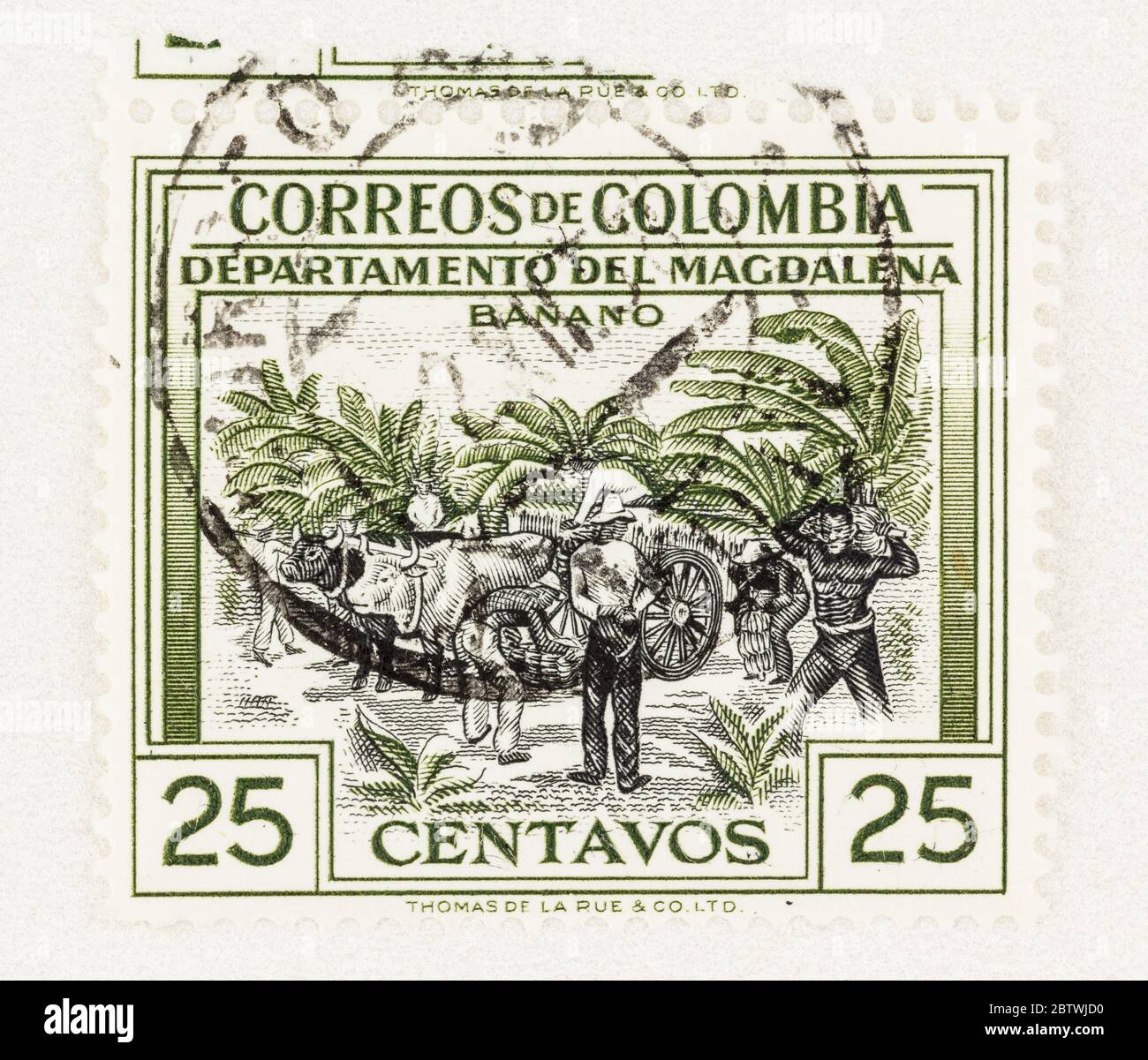 SEATTLE WASHINGTON - May 25, 2020:  Banana plantation with oxen, farm workers and banana harvesting on 1956 Columbia stamp. Scott # 656 Stock Photo