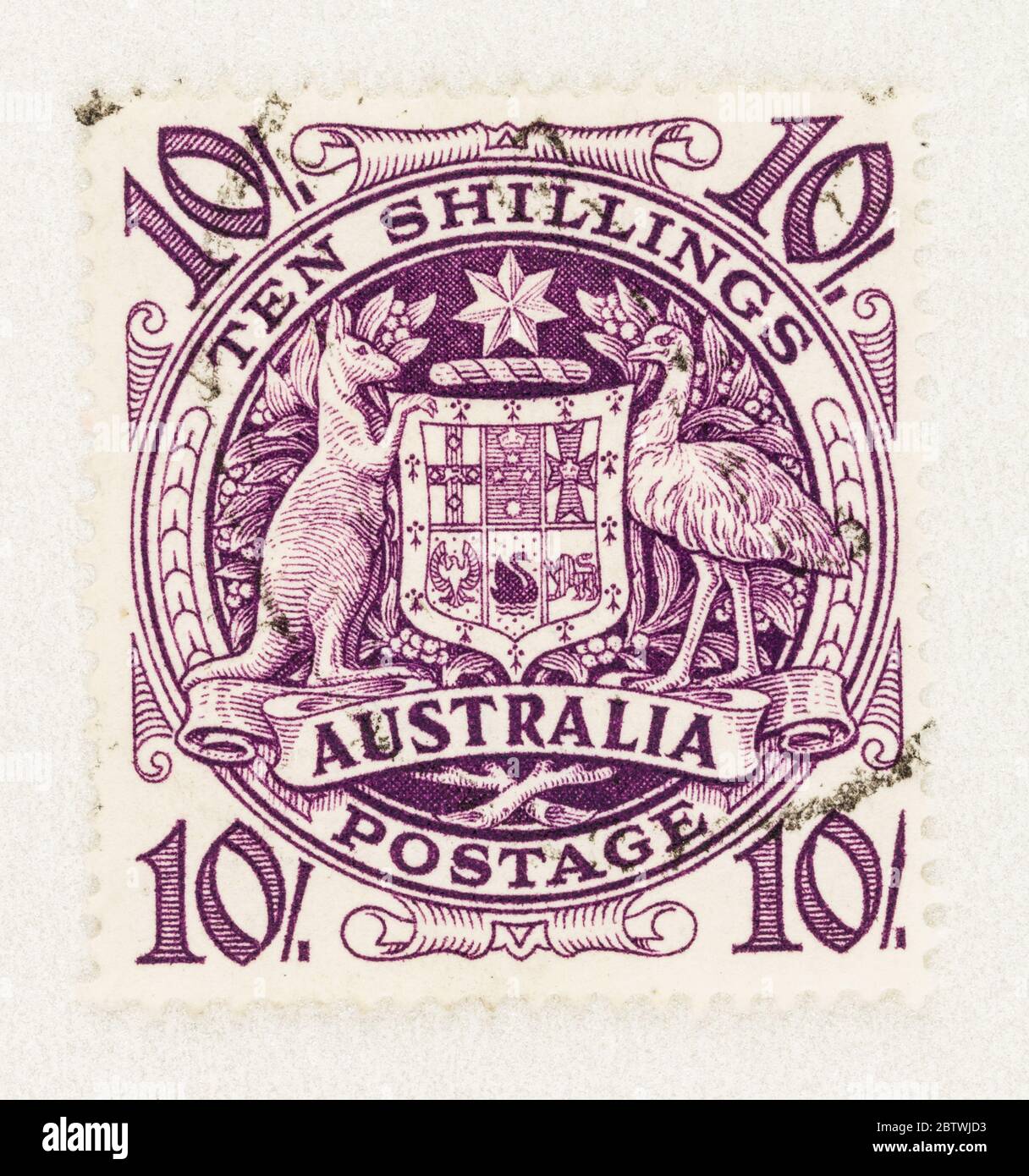 SEATTLE WASHINGTON - May 27, 2020:  Australian Coat of Arms 10 shilling stamp featuring purple shield, kangaroo and emu. Scott # 219 Stock Photo