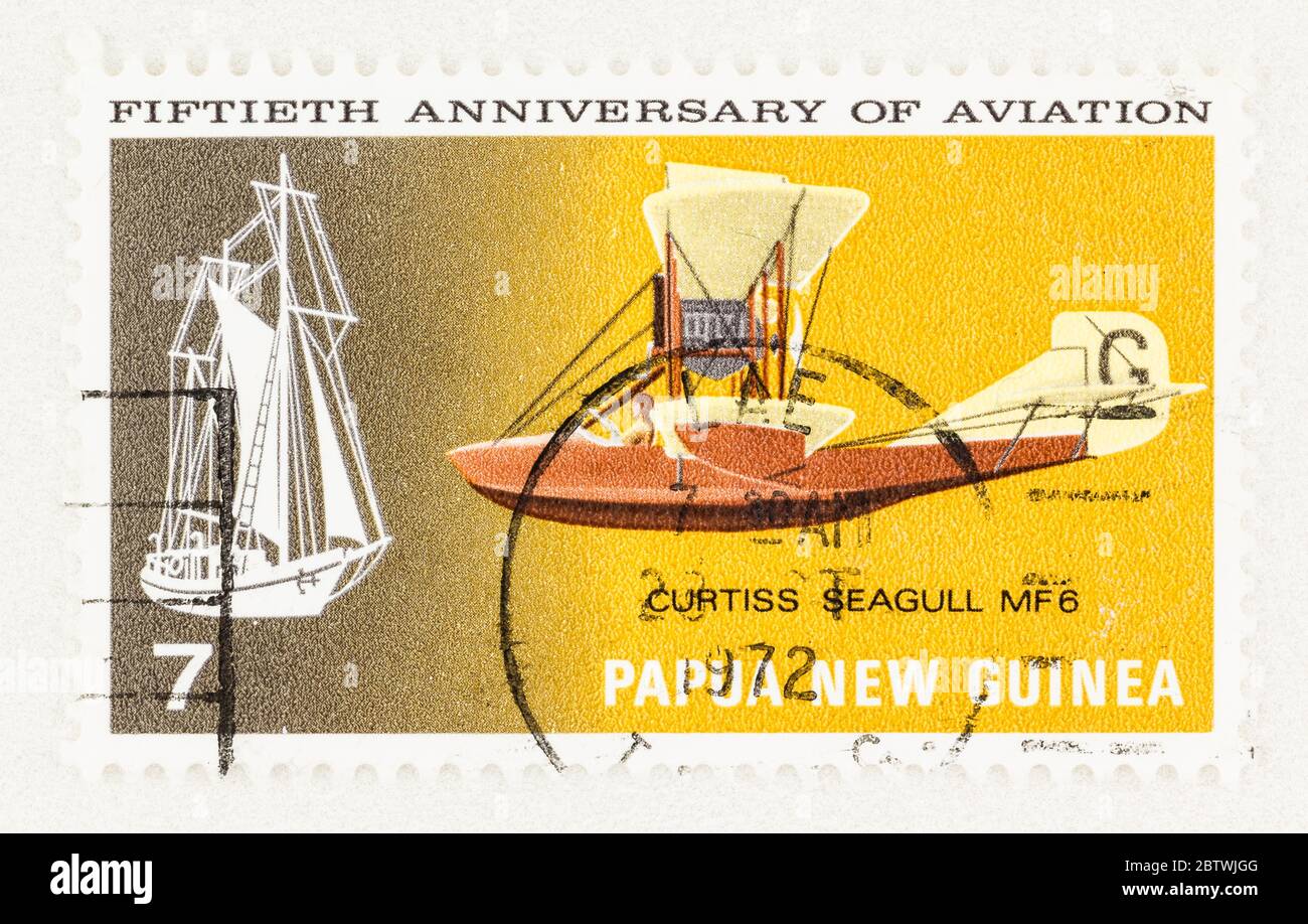 SEATTLE WASHINGTON - May 25, 2020:   Curtiss Seagull MF6 air boat and Schooner Eureka on 1972 Papua New Guinea. Scott # 348 Stock Photo
