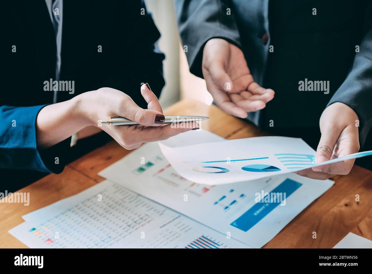 Business People Analyzing Statistics Business Documents, Financial Concept Stock Photo