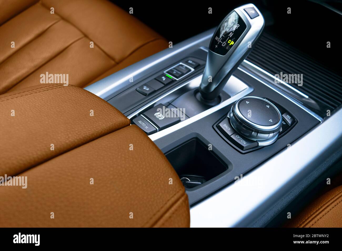 Automatic gear stick (transmission) of a modern car. Multimedia and