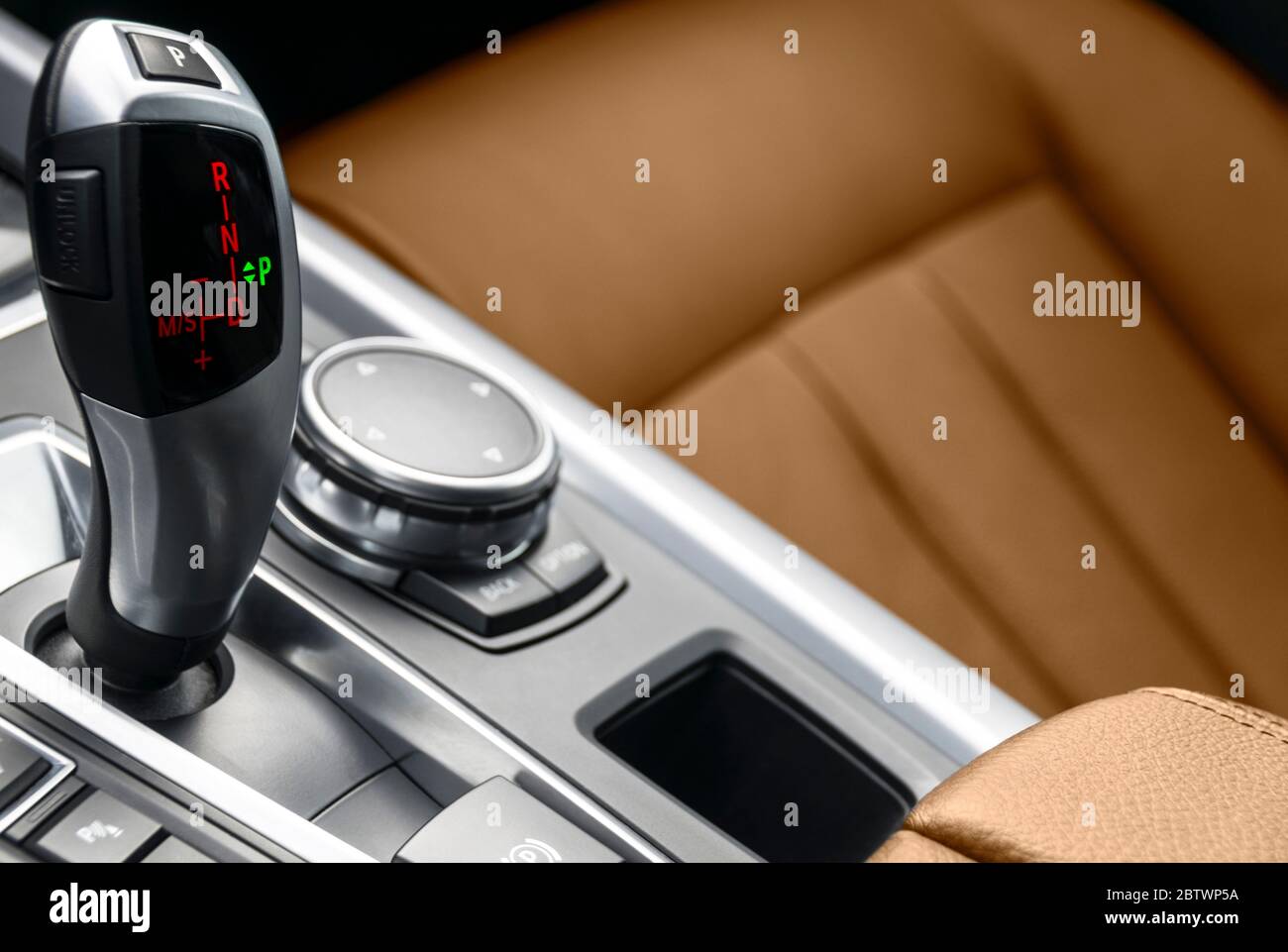 Automatic gear stick transmission of a modern car. Multimedia and