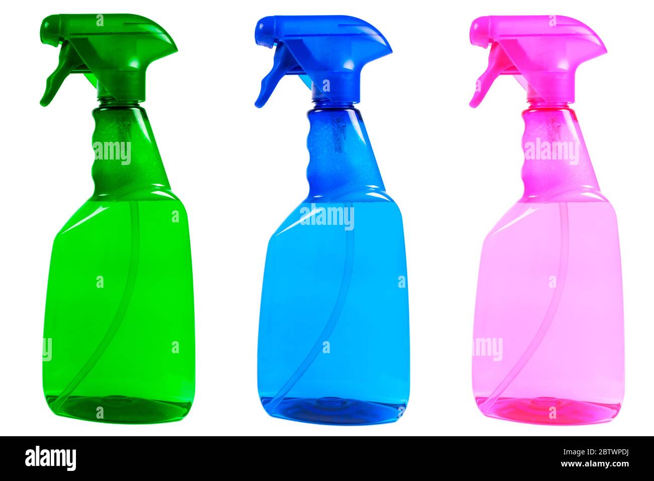 Three multicolored plastic water spray bottles isolated on white