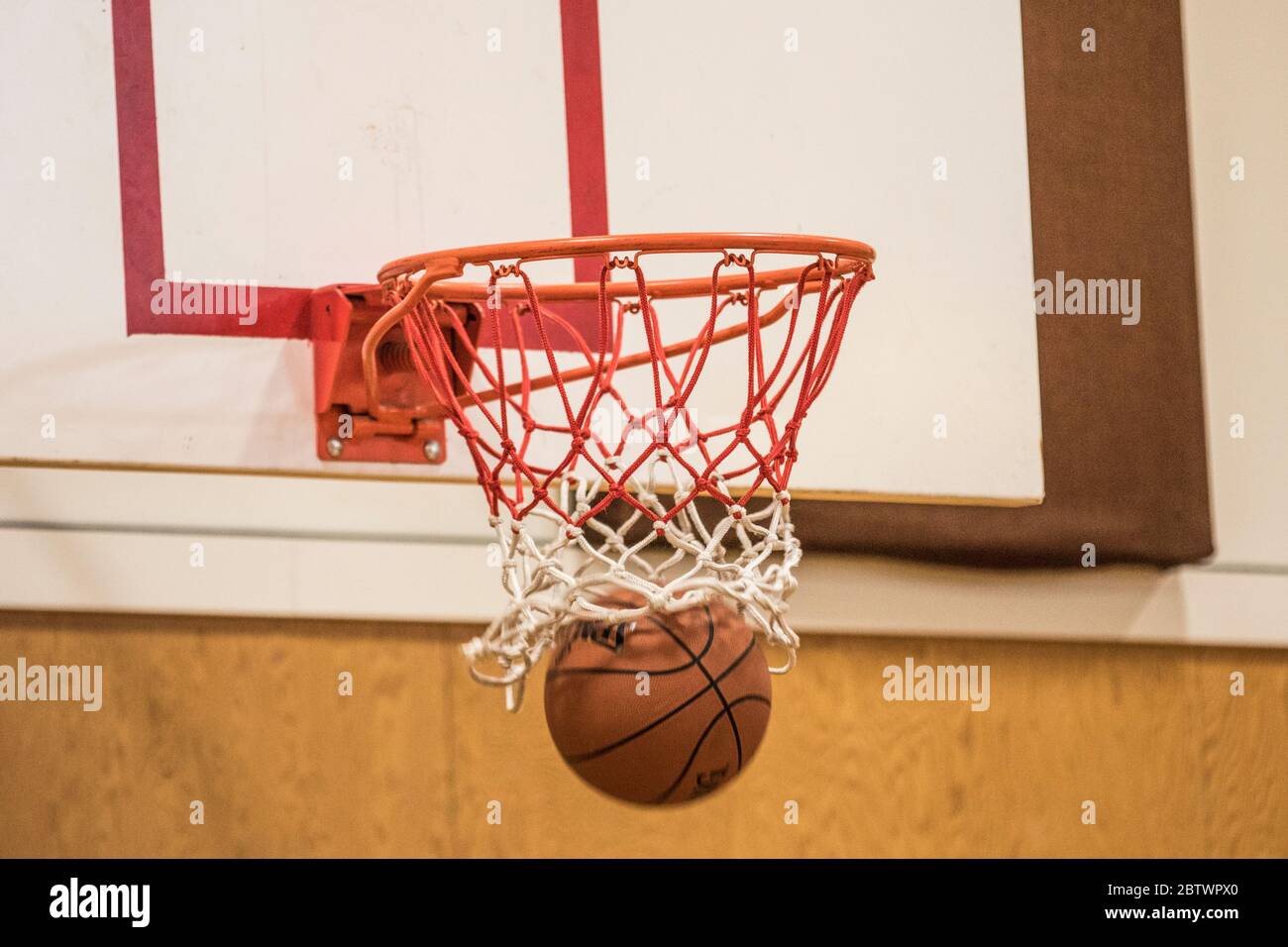 Basketball shot going in net. Stock Photo