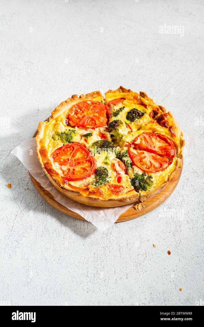 Savory tart with broccoli on white surface, healthy food Stock Photo