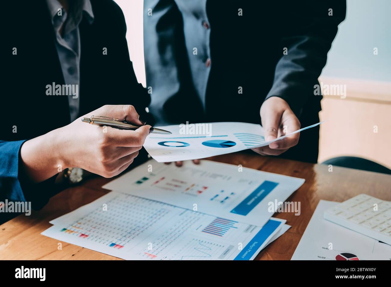 Business People Analyzing Statistics Business Documents, Financial Concept Stock Photo