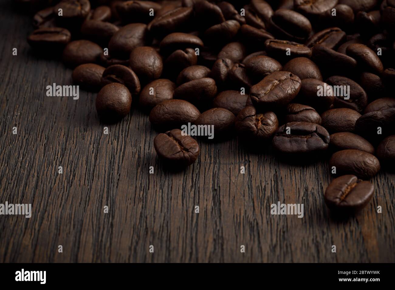 The hot of brown roasted coffee beans on brown background with ...