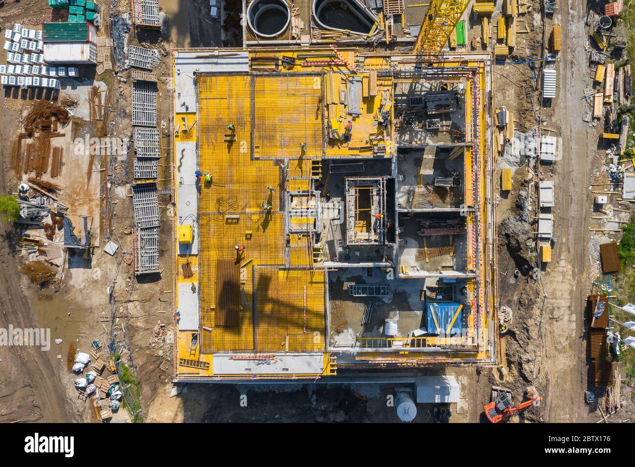 Aerial view of construcion site. People working. Top view of new