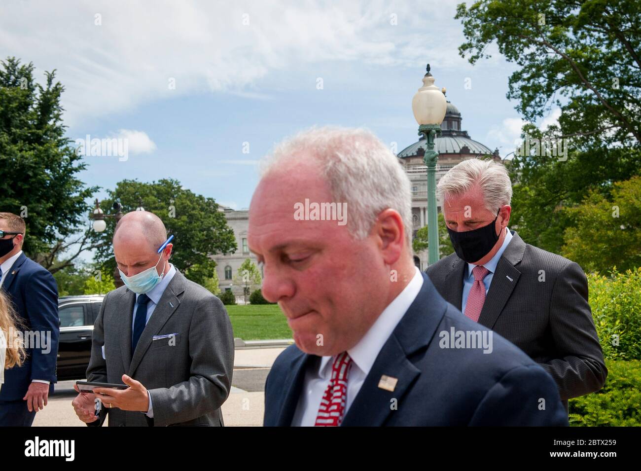 House Minority Leader Rep. Kevin McCarthy (R-Calif.) wears his face mask following a media availability with House Minority Whip Rep. Steve Scalise (R-LA), House GOP Conference Chairwoman Liz Cheney (R-WY) and others, to announce that Republican leaders have filed a lawsuit against House Speaker Nancy Pelosi and congressional officials in an effort to block the House of Representatives from using a proxy voting system to allow for remote voting during the coronavirus pandemic, outside of the U.S. Capitol in Washington, DC., Wednesday, May 27, 2020. Credit: Rod Lamkey/CNP | usage worldwide Stock Photo