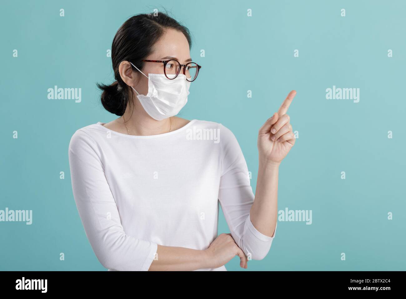 Asian young girl is wearing medical face masks to protect themselves from pollution Coronavirus flu virus, New coronavirus 2019-nCoV from China, Empty Stock Photo
