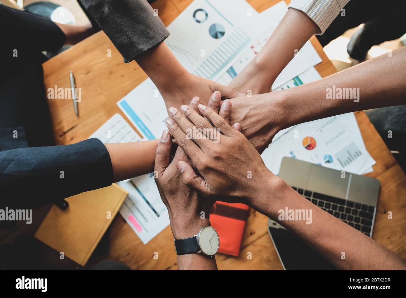 Teamwork Success. Business people group team happy showing teamwork and joining hands after meeting partner business Stock Photo