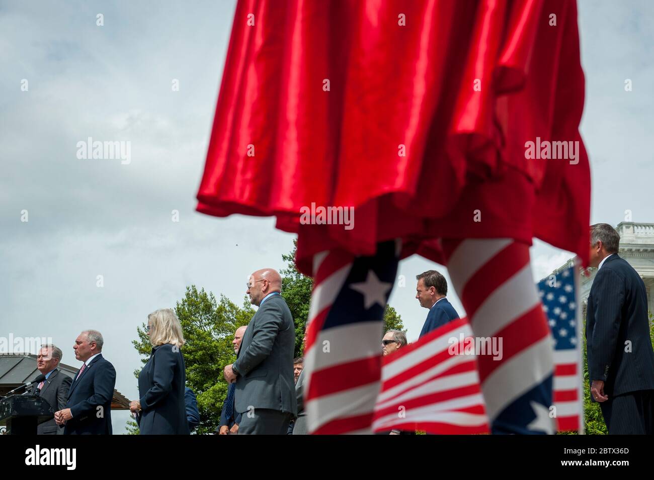 Michael Wheeler, of Kansas City, MO, wear his 'Super Jesus' outfit with cape and US flag, while House Minority Leader Rep. Kevin McCarthy (R-Calif.) holds a media availability with House Minority Whip Rep. Steve Scalise (R-LA), House GOP Conference Chairwoman Liz Cheney (R-WY) and others, to announce that Republican leaders have filed a lawsuit against House Speaker Nancy Pelosi and congressional officials in an effort to block the House of Representatives from using a proxy voting system to allow for remote voting during the coronavirus pandemic, outside of the U.S. Capitol in Washington, DC. Stock Photo