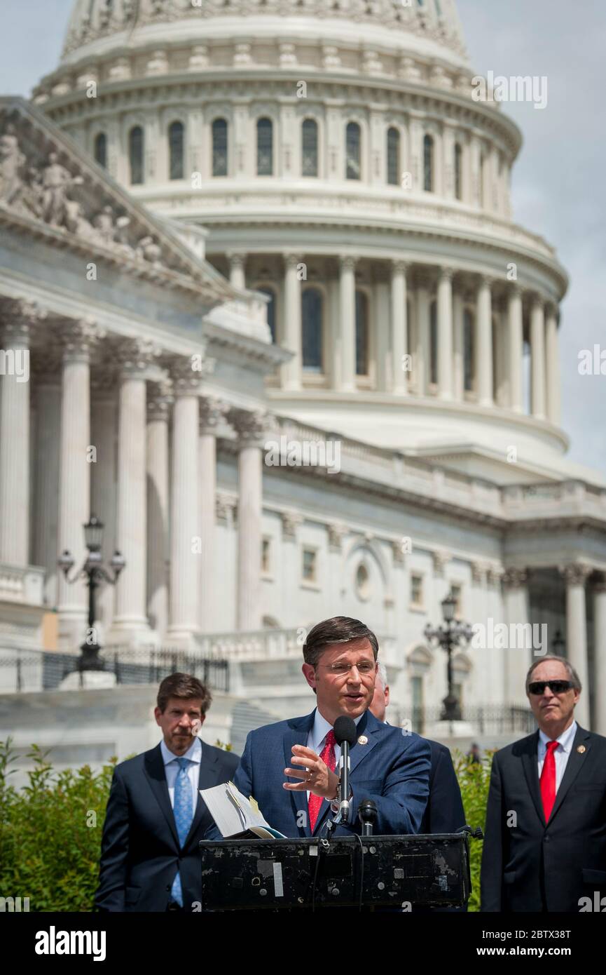 Rep. Mike Johnson (R-LA) offers remarks and holds a House Rules and Manual book as he joins House Minority Leader Rep. Kevin McCarthy (R-Calif.), House Minority Whip Rep. Steve Scalise (R-LA), House GOP Conference Chairwoman Liz Cheney (R-WY) and others, to announce that Republican leaders have filed a lawsuit against House Speaker Nancy Pelosi and congressional officials in an effort to block the House of Representatives from using a proxy voting system to allow for remote voting during the coronavirus pandemic, outside of the U.S. Capitol in Washington, DC., Wednesday, May 27, 2020. Credit: Stock Photo