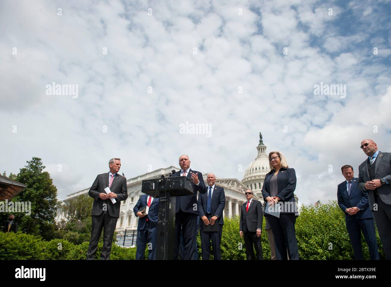 House Minority Whip Rep. Steve Scalise (R-LA, center) offers remarks as he is joined by House Minority Leader Rep. Kevin McCarthy (R-Calif., left), House GOP Conference Chairwoman Liz Cheney (R-WY) and others, to announce that Republican leaders have filed a lawsuit against House Speaker Nancy Pelosi and congressional officials in an effort to block the House of Representatives from using a proxy voting system to allow for remote voting during the coronavirus pandemic, outside of the U.S. Capitol in Washington, DC., Wednesday, May 27, 2020. Credit: Rod Lamkey/CNP | usage worldwide Stock Photo