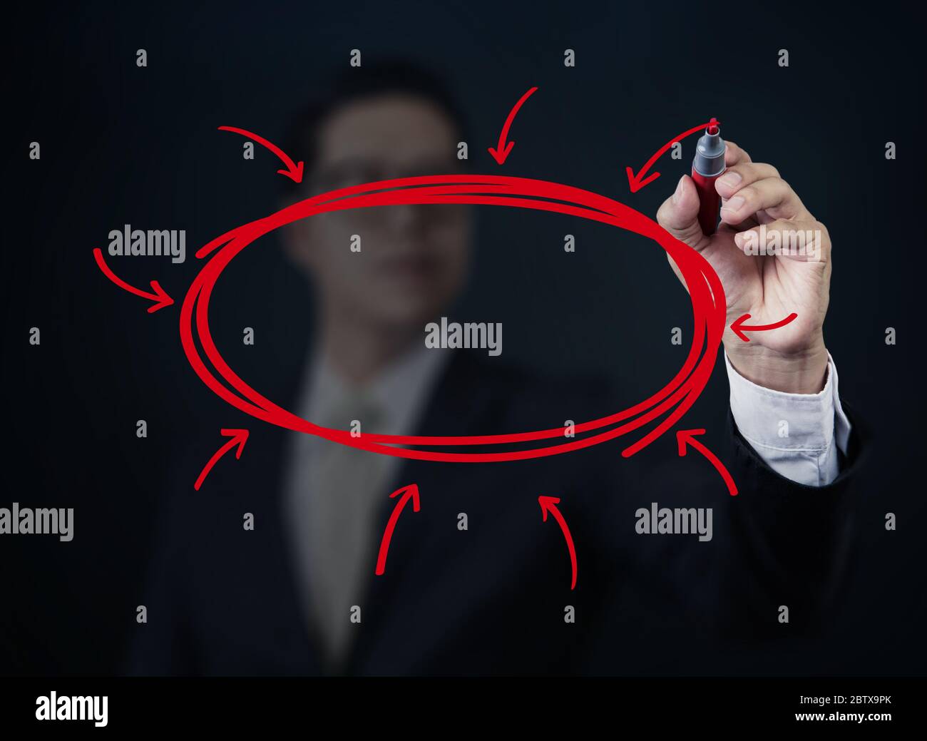 Businessman hand writing somting with red marker on transparent board, new business concept, studio shot Stock Photo