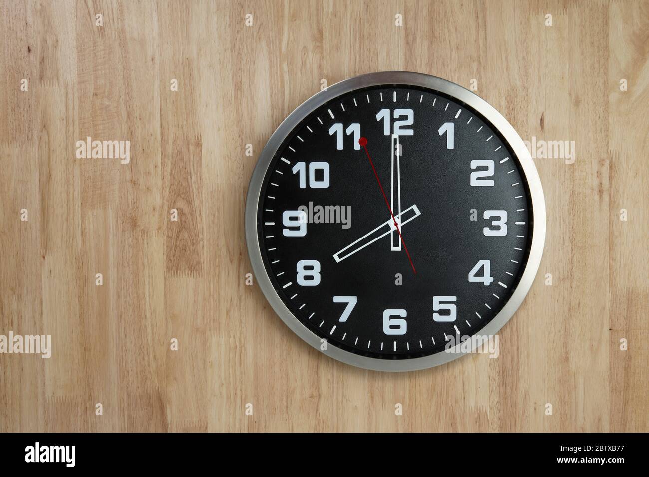 Standless Clock on Wooden Background, 8 O'Clock Stock Photo