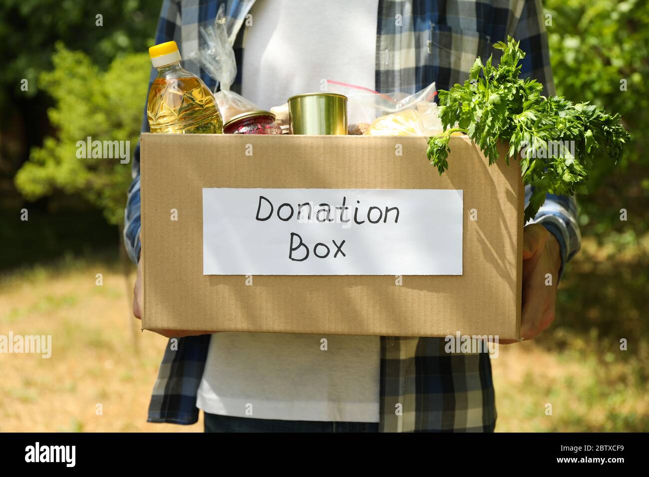 Man giving donation box hi-res stock photography and images - Alamy