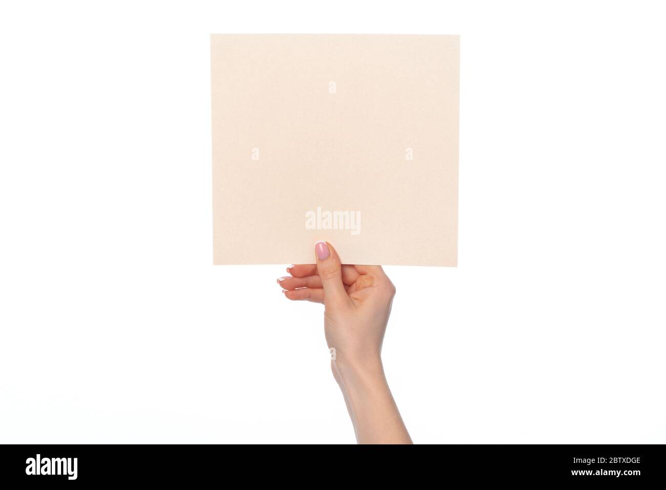 Female hand holding blank white sheet of paper isolated on white Stock ...