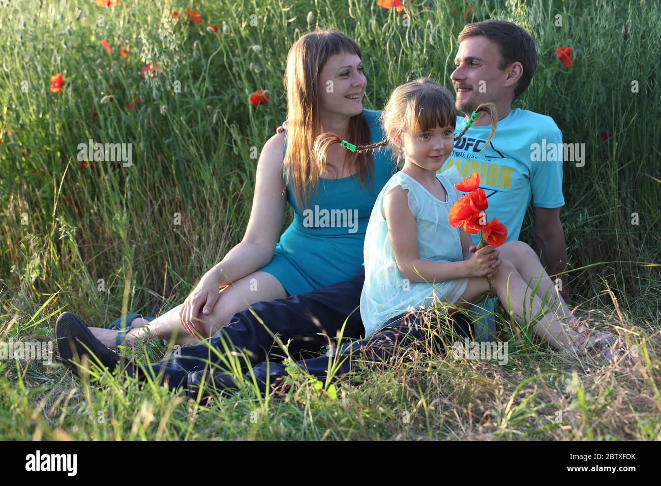 Happy family in the park Stock Photo - Alamy