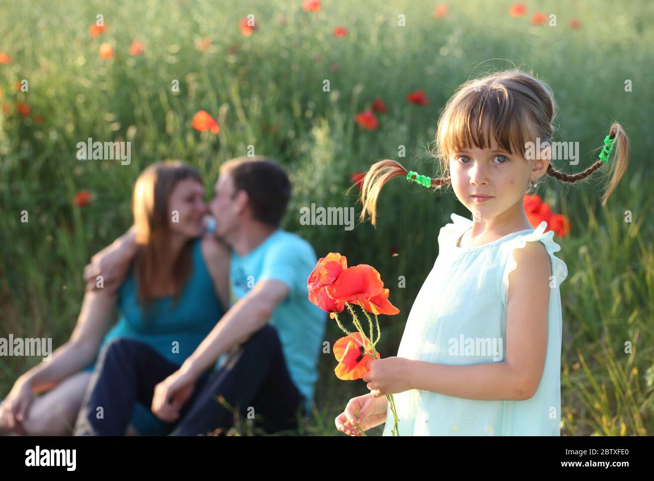 Happy family in the park Stock Photo - Alamy