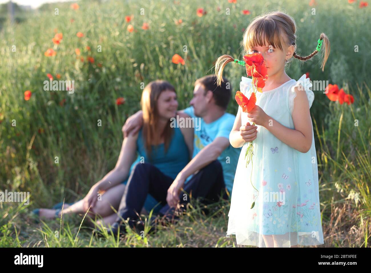 Happy family in the park Stock Photo - Alamy