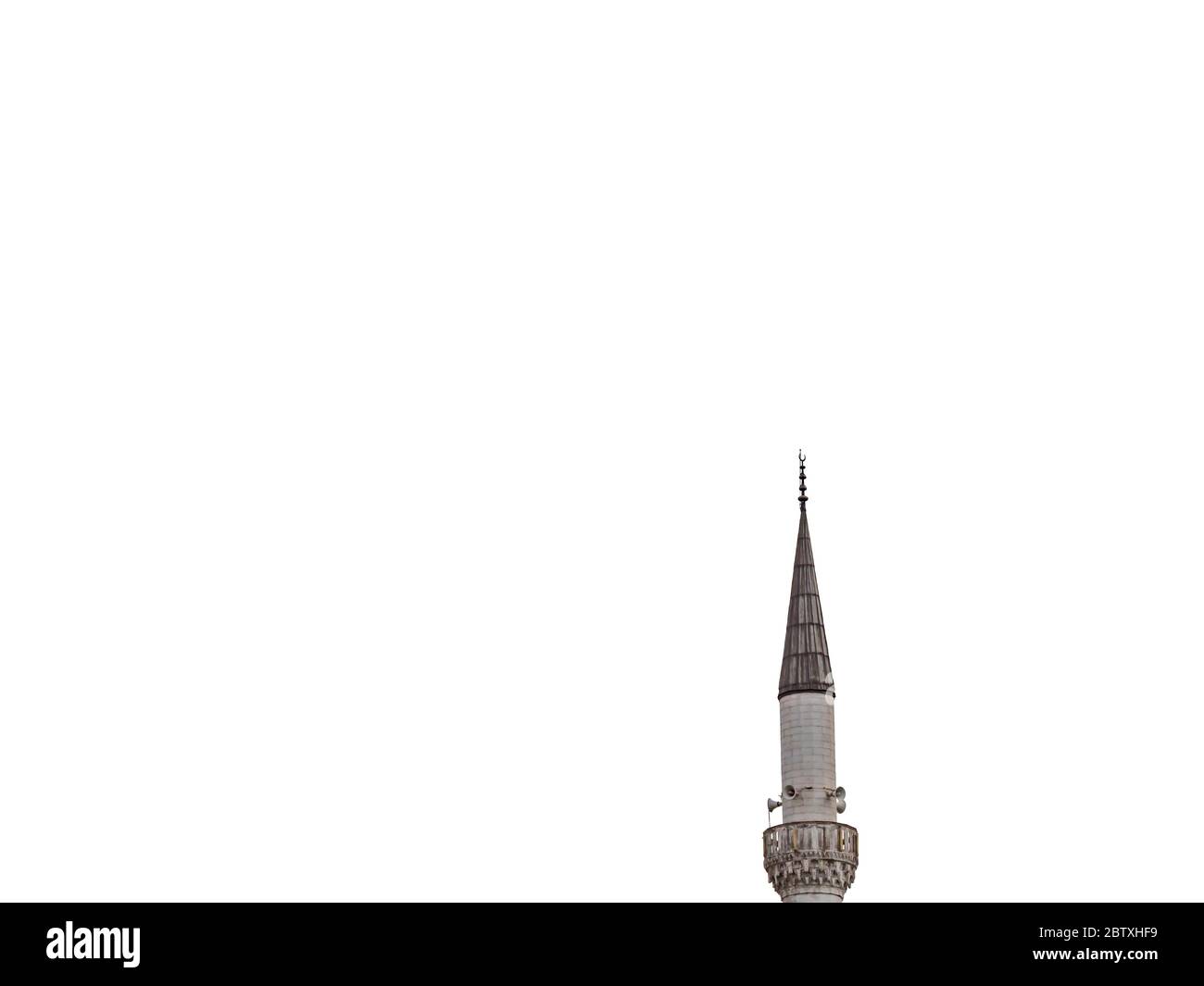 Minaret of a Muslim mosque on isolated white background. minaret aspiring to heaven. Stock Photo