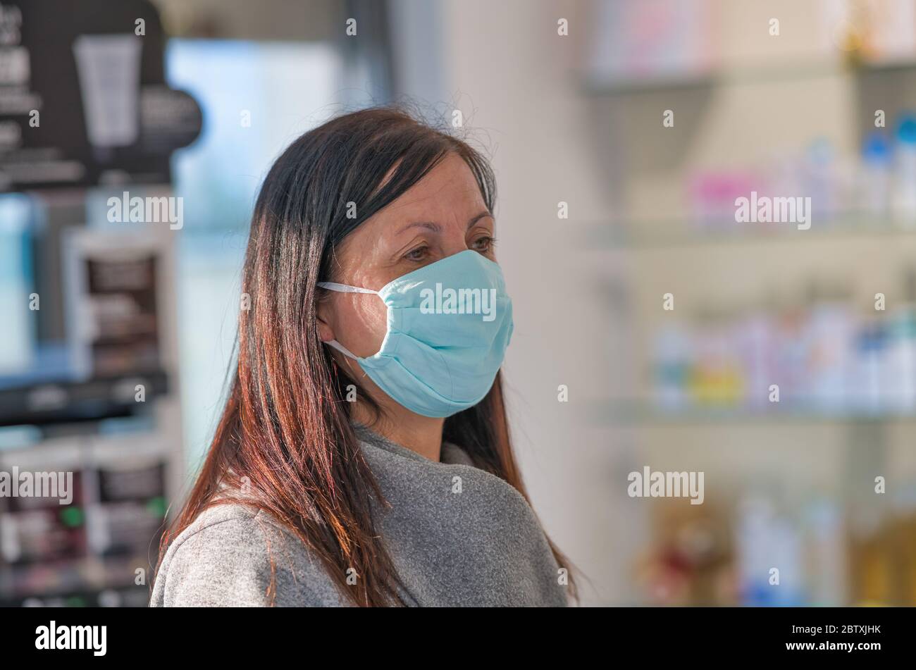 Woman wearing mask inside a local pharmacy Stock Photo Alamy