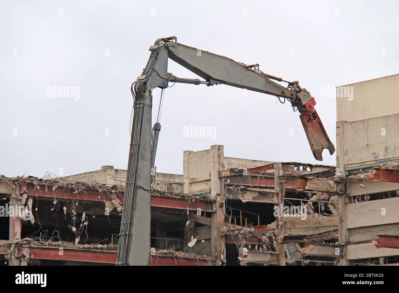 The Grab of a Pulveriser Demolishing a Building. Stock Photo