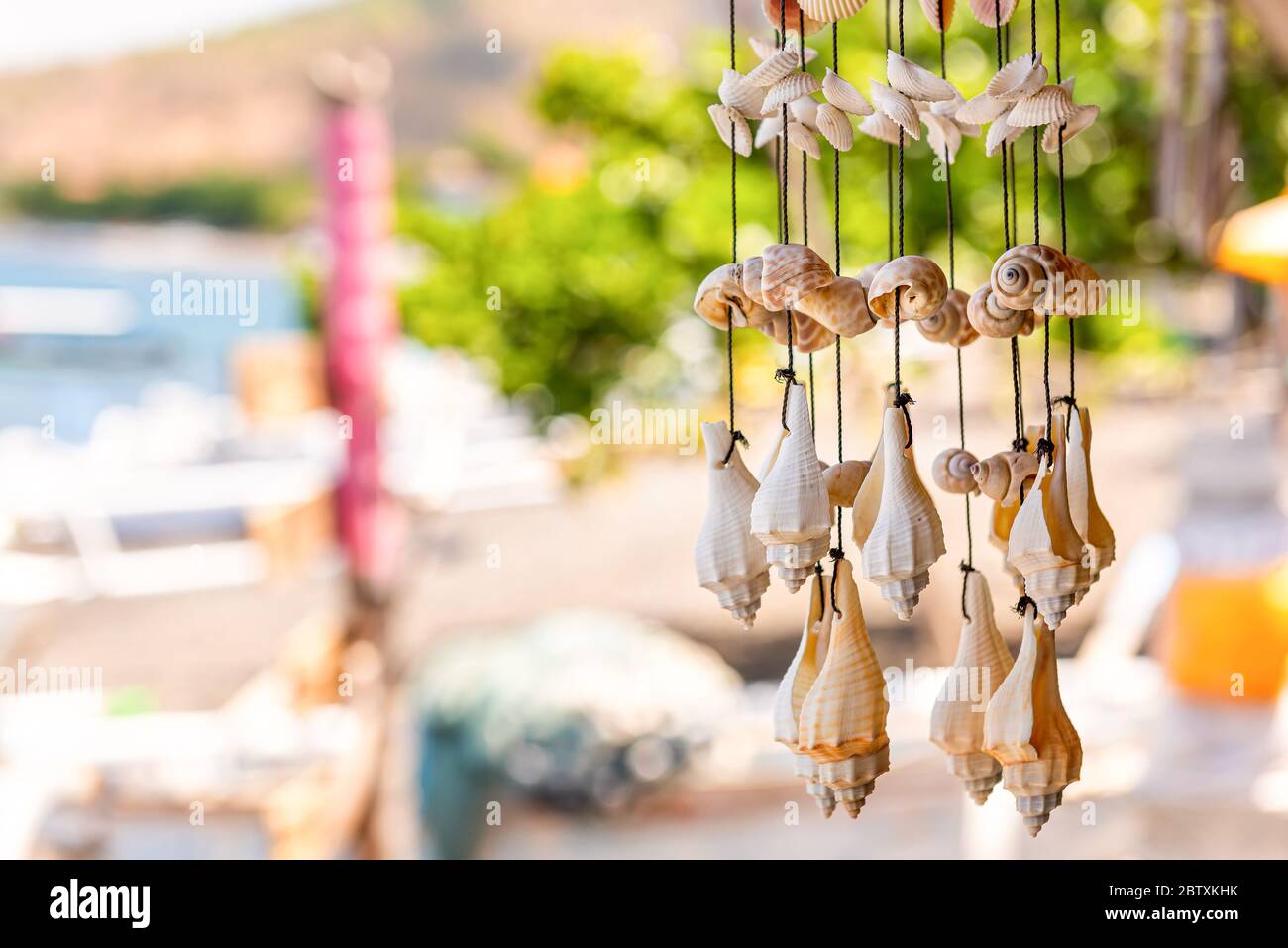 Wall decor made of shells. Handmade wind chimes of seashells. Bali, Indonesia Stock Photo