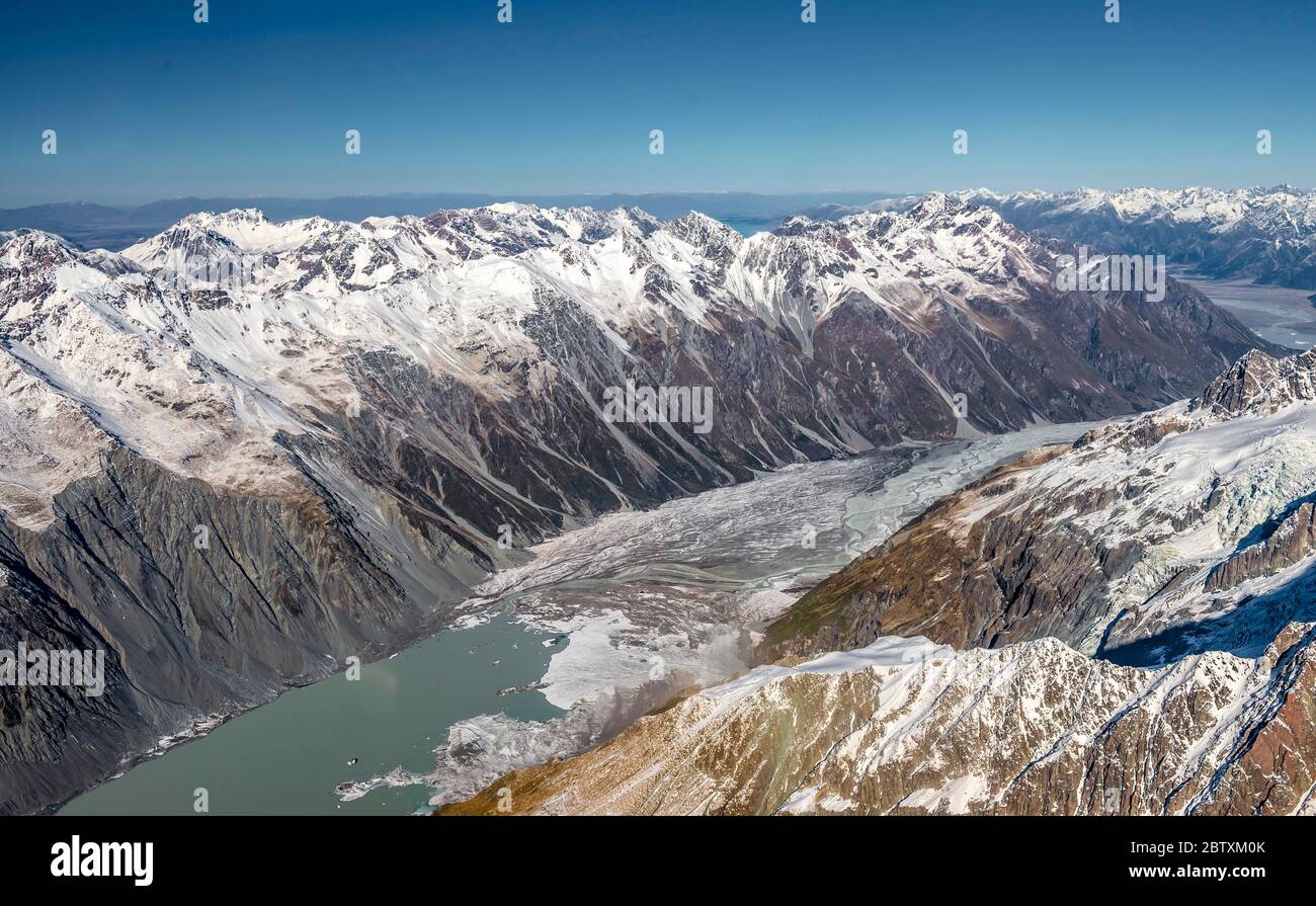 Valley with glacial lake Tasman Lake and glaciated mountain peaks, Mount Cook National Park, New Zealand Alps, Canterbury Region, New Zealand Stock Photo