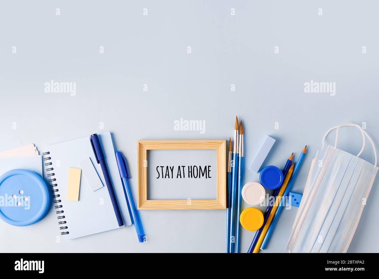 Concept of self quarantine at home. Preventative measure against virus outbreak. inspiration quote, staying at home during pandemic. School work stude Stock Photo