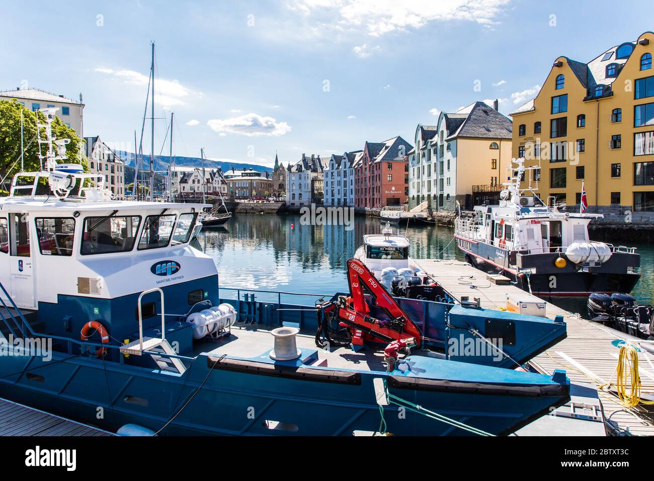 Alesund, Norway - June 2019: Summer view of Alesund port town on the west coast of Norway, at the entrance to the Geirangerfjord. Old architecture of Stock Photo