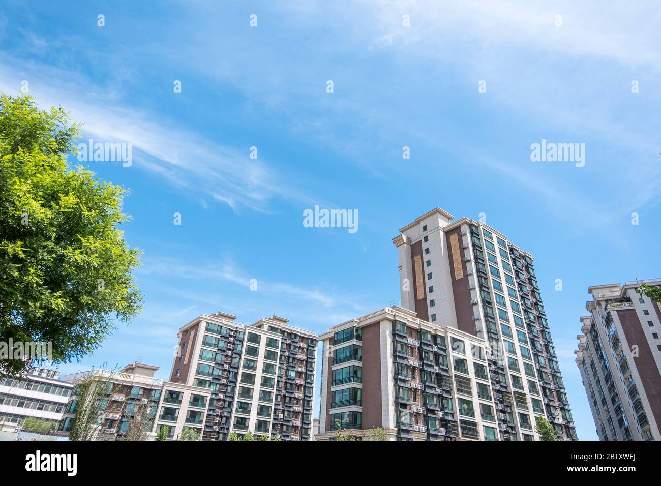Residential area under blue sky and white clouds Stock Photo - Alamy