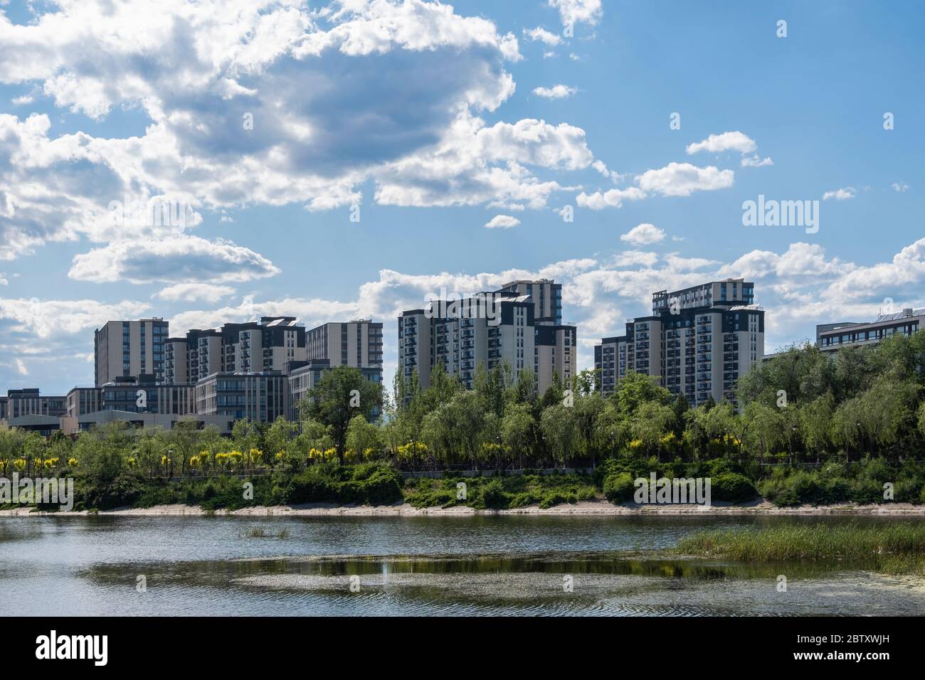 Residential area under blue sky and white clouds Stock Photo - Alamy